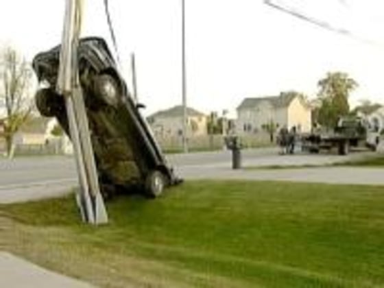 The car rests against the pole in Waukee on Sunday.